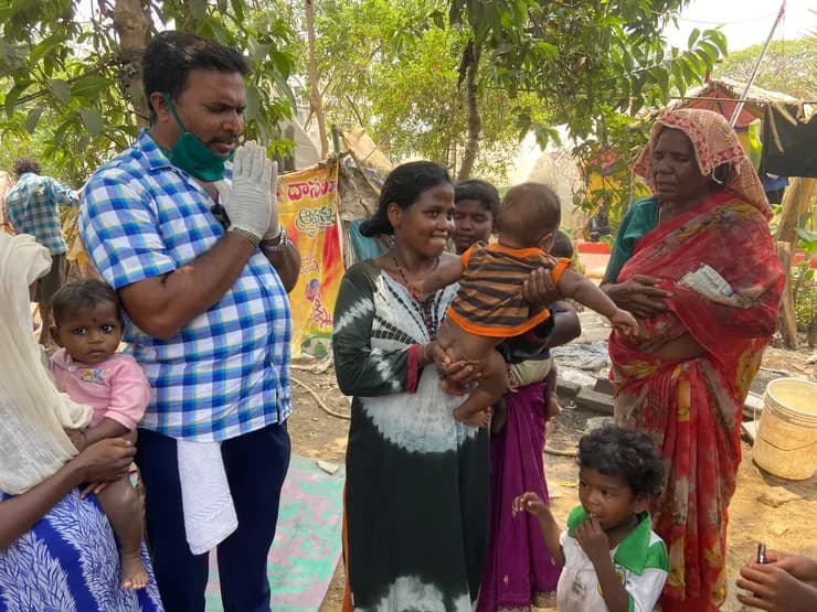 COVID feeding — volunteers serving food packs
