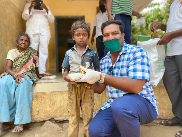 COVID feeding — Pastor Jay with volunteers